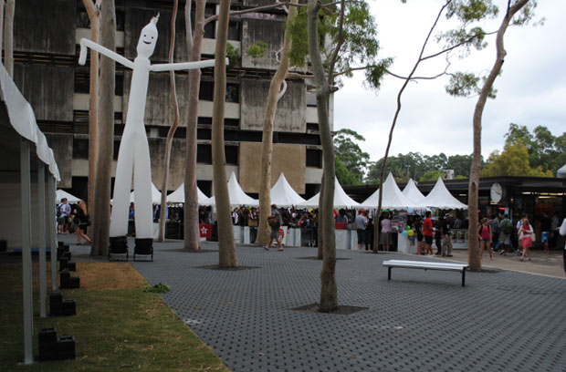 White fete stalls with white air dancer at Macquarie Uni